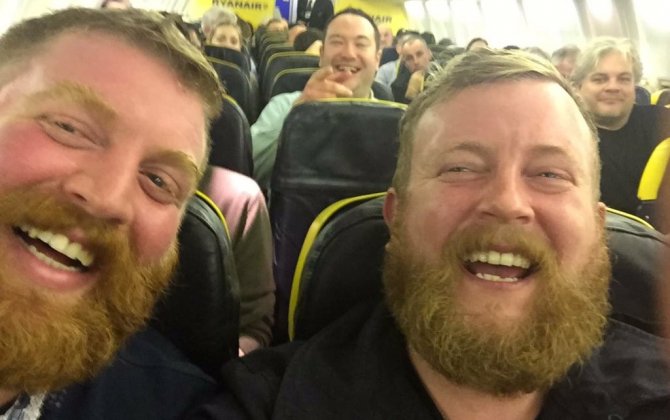 Passenger seated on plane next to stranger who looks exactly like him