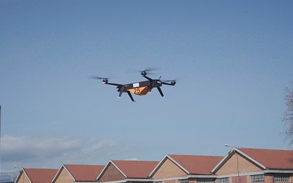 Italy first demonstration of a drone with electrically-powered propulsion transporting heavy goods